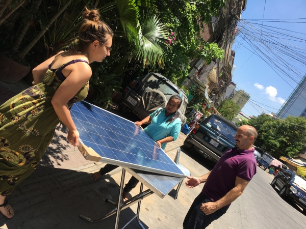 NRG Solutions / Krousar Solar staff installs a large solar panel