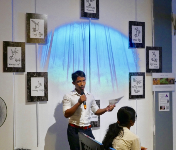 Sophea Chea, Deputy Director of Bophana Center provides feedback to the artist teams in front of "Circle Time" augmented reality installation by Michael Kuetemeyer & Anula Shetty